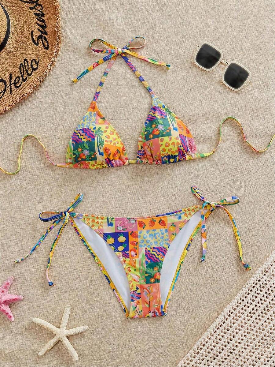 Women's black and white zebra print two-piece bikini set featuring a high waist tie-side bottom and a backless halter top with removable padding.