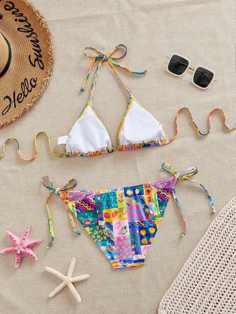 Women's black and white zebra print two-piece bikini set featuring a high waist tie-side bottom and a backless halter top with removable padding.