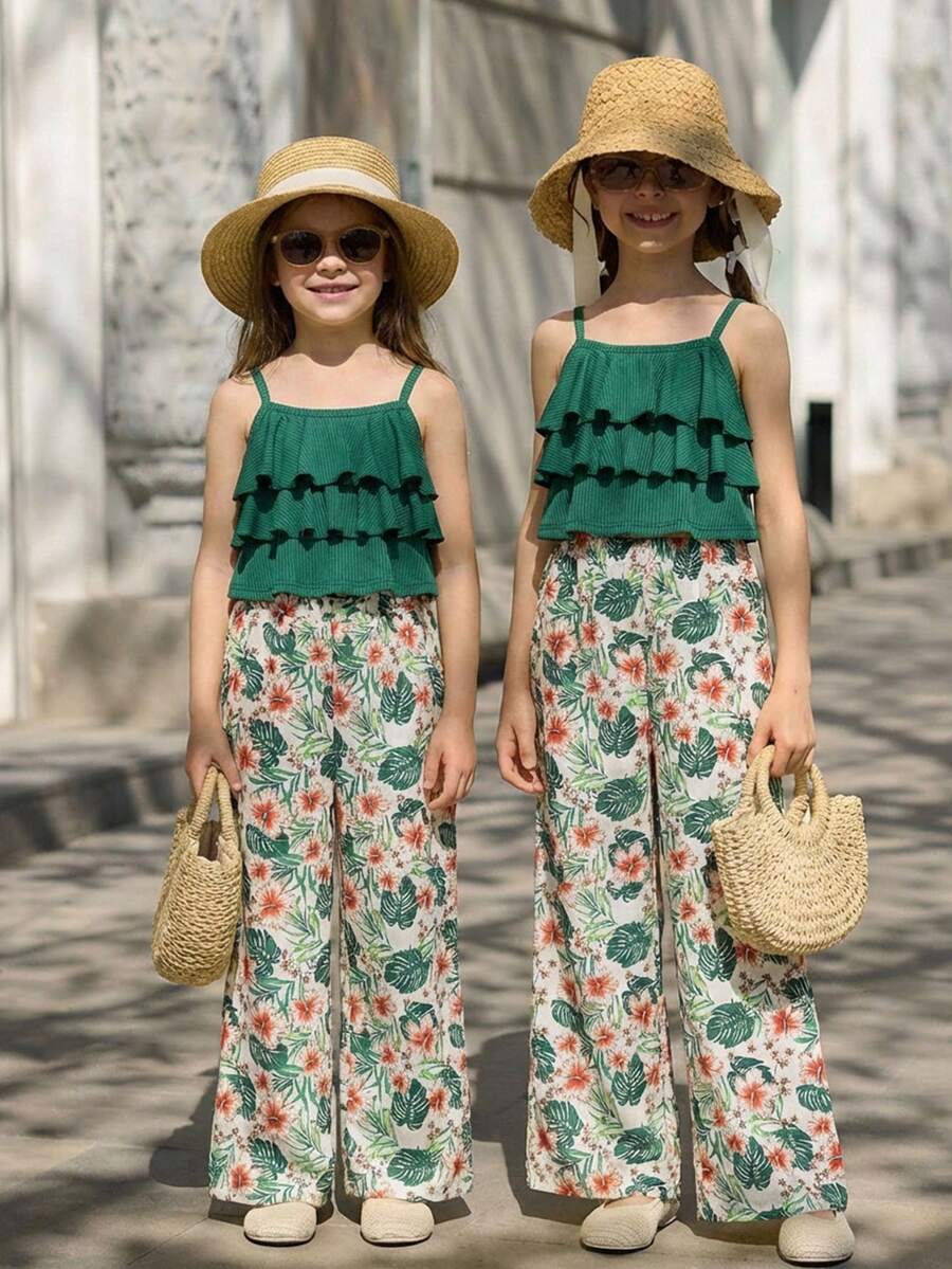Tween girls blue 2-piece vacation outfit set featuring a tiered ruffle spaghetti strap camisole and loose high-waist pants.