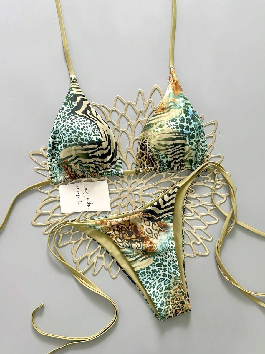 Women's vintage leopard print 2-piece bikini set featuring a high waist tie-side bottom and a halter neck triangle top.