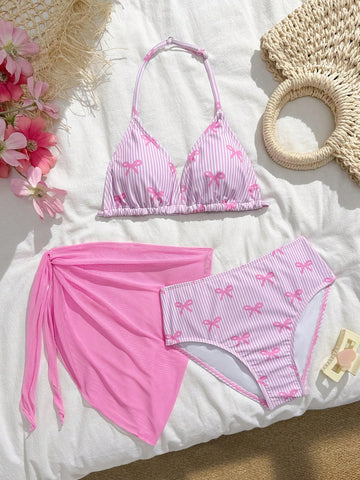 Tween girls 3-piece swimwear set in pink featuring a striped triangle halter bikini top with bow detail and adjustable neck and back ties, an adjustable mid-waist bikini bottom, and a sheer pink mesh skirt cover-up for beach or pool wear.