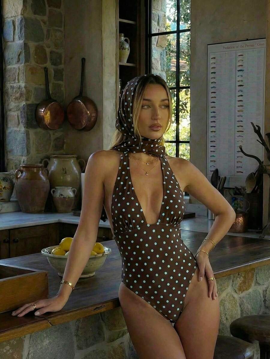 Women's apricot polka dot two-piece swimsuit featuring an asymmetrical halter backless top with knot tie detail and high-waisted bottoms.
