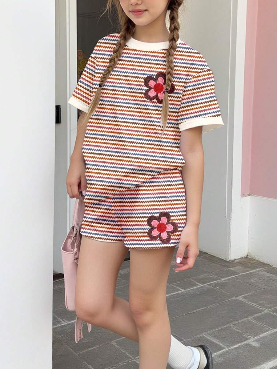 Tween girls multicolor tie-dye 2-piece outfit set featuring a drop-shoulder short-sleeve t-shirt and matching loose track shorts with side pockets.