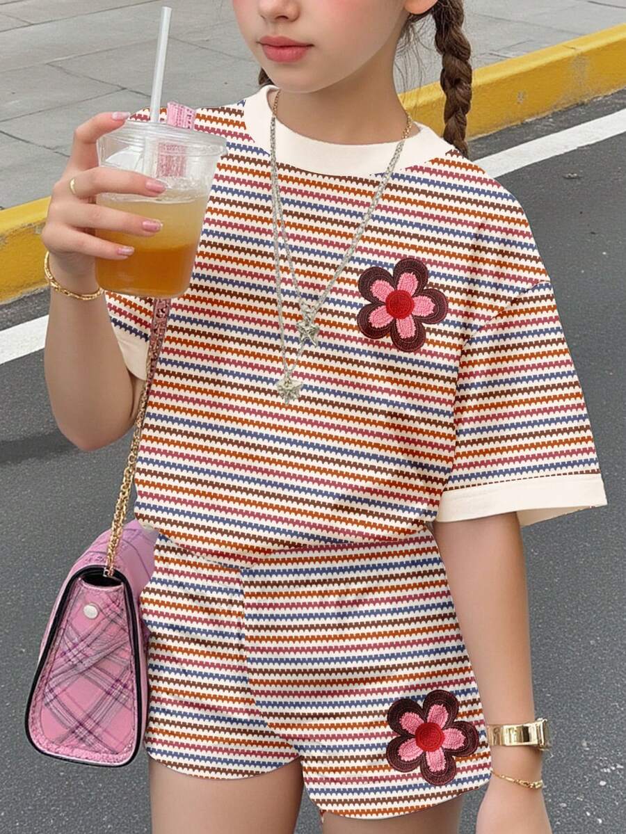 Tween girls multicolor tie-dye 2-piece outfit set featuring a drop-shoulder short-sleeve t-shirt and matching loose track shorts with side pockets.