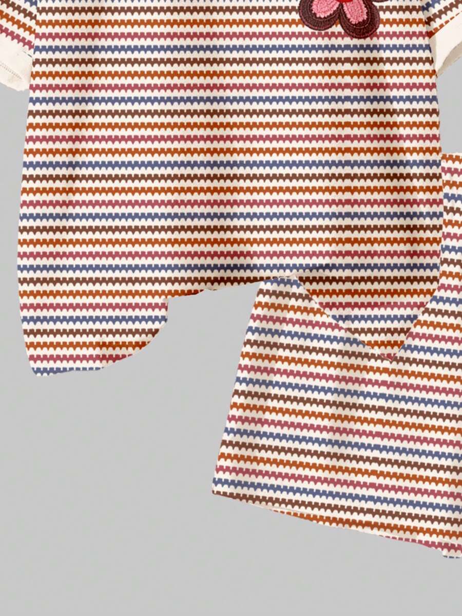 Tween girls multicolor tie-dye 2-piece outfit set featuring a drop-shoulder short-sleeve t-shirt and matching loose track shorts with side pockets.