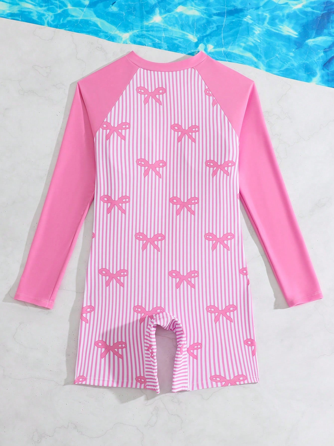 Tween girls one-piece swimsuit featuring a high neck, long sleeves, and shorts bottom, with a back zipper and strawberry plaid digital print on stretch knit fabric. Designed for swimming, vacation, and summer wear.