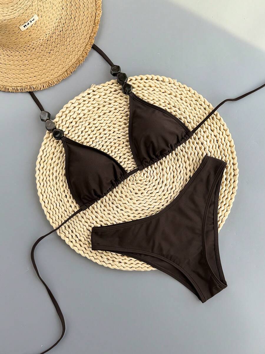 Women's apricot 2-piece halter bikini set featuring a wireless triangle top with tie-back detail and high-waisted high-cut bottoms.