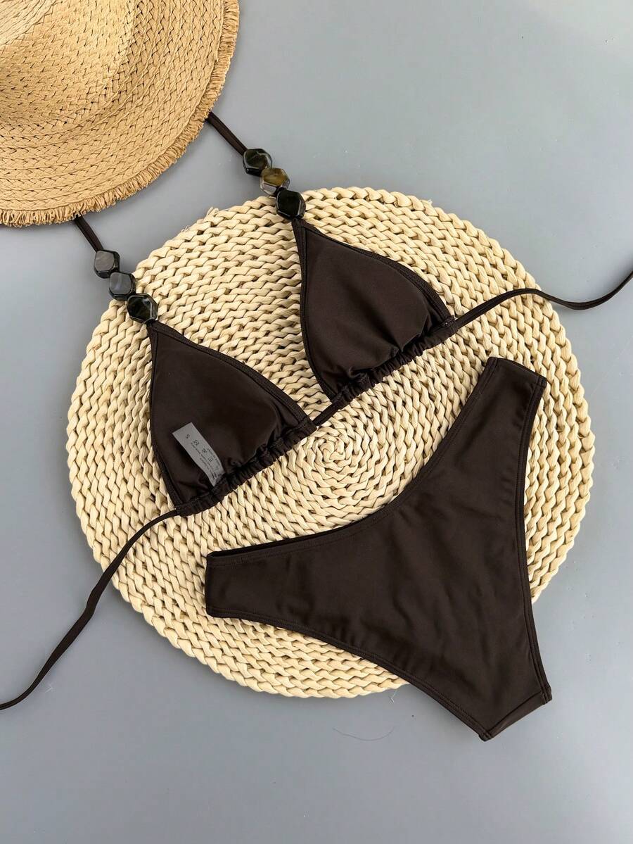 Women's apricot 2-piece halter bikini set featuring a wireless triangle top with tie-back detail and high-waisted high-cut bottoms.