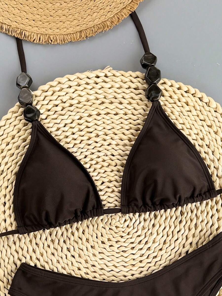 Women's apricot 2-piece halter bikini set featuring a wireless triangle top with tie-back detail and high-waisted high-cut bottoms.