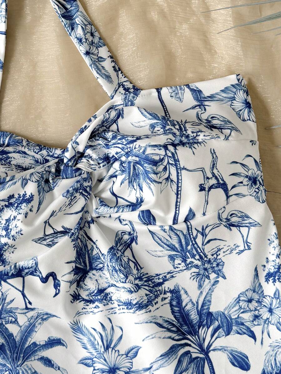 Tween girls blue and white floral halter sundress with shirred detail, sleeveless cami style, high waist, and tiered ruffle hem for vacation wear
