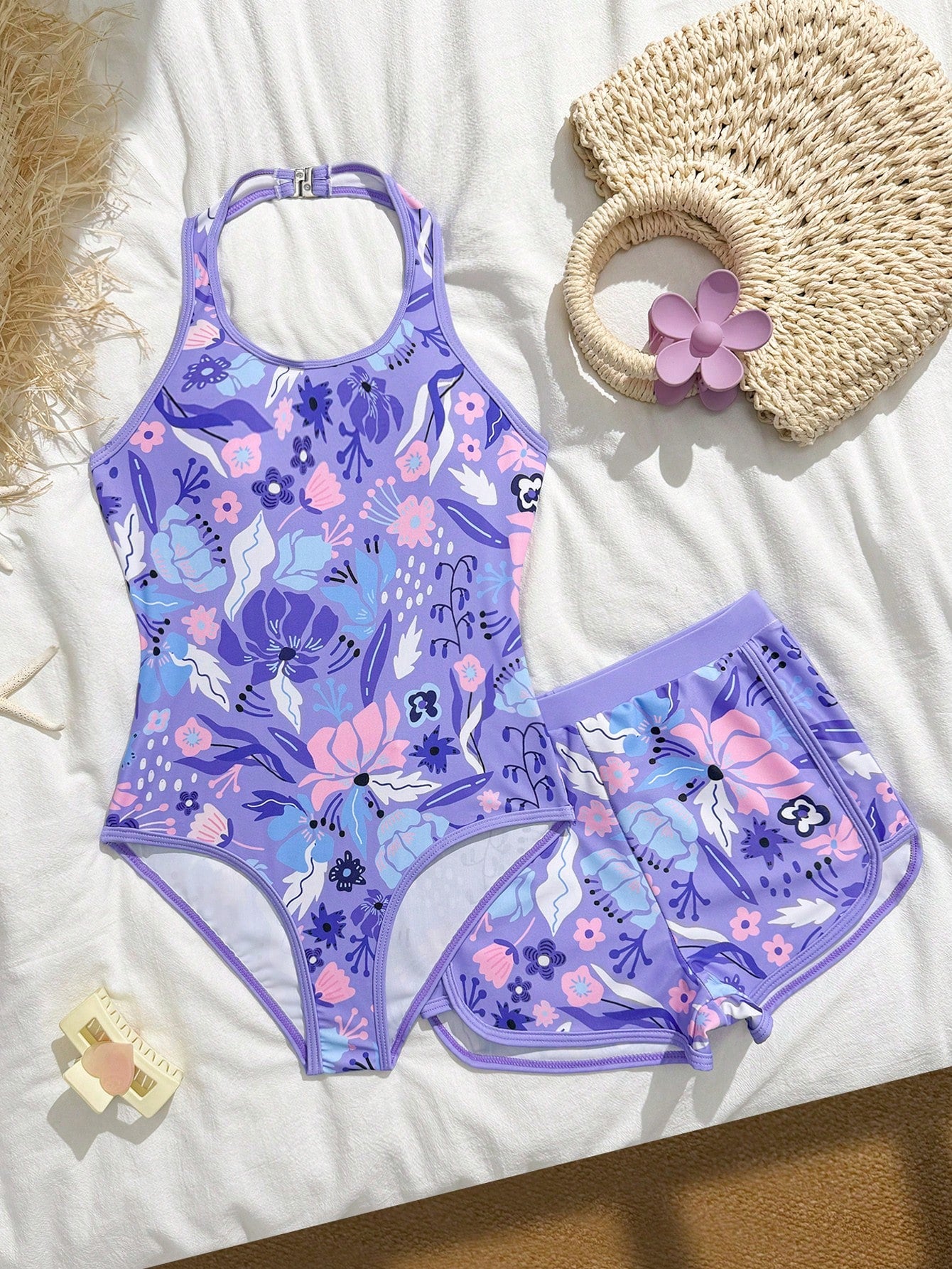 Girls 2-piece swimwear set featuring a butterfly print halter swimsuit top with contrast piping and separate mid-waist shorts; sleeveless, high-stretch, wireless design for beach and vacation wear.