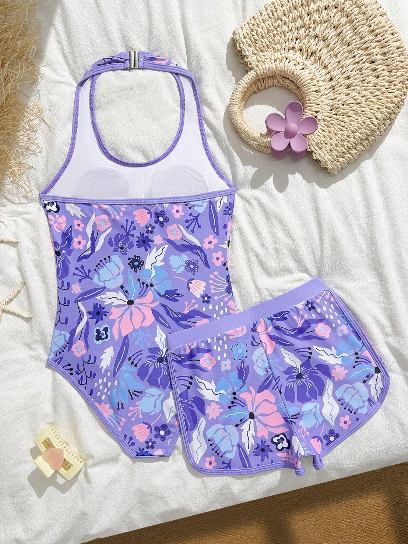 Girls 2-piece swimwear set featuring a butterfly print halter swimsuit top with contrast piping and separate mid-waist shorts; sleeveless, high-stretch, wireless design for beach and vacation wear.