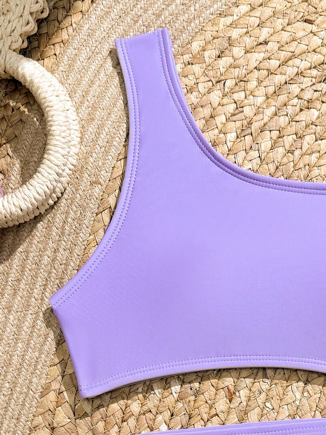Purple tween girls one-piece swimsuit with asymmetrical neckline, cut-out waist, striped pattern, fitted silhouette, and lined body.