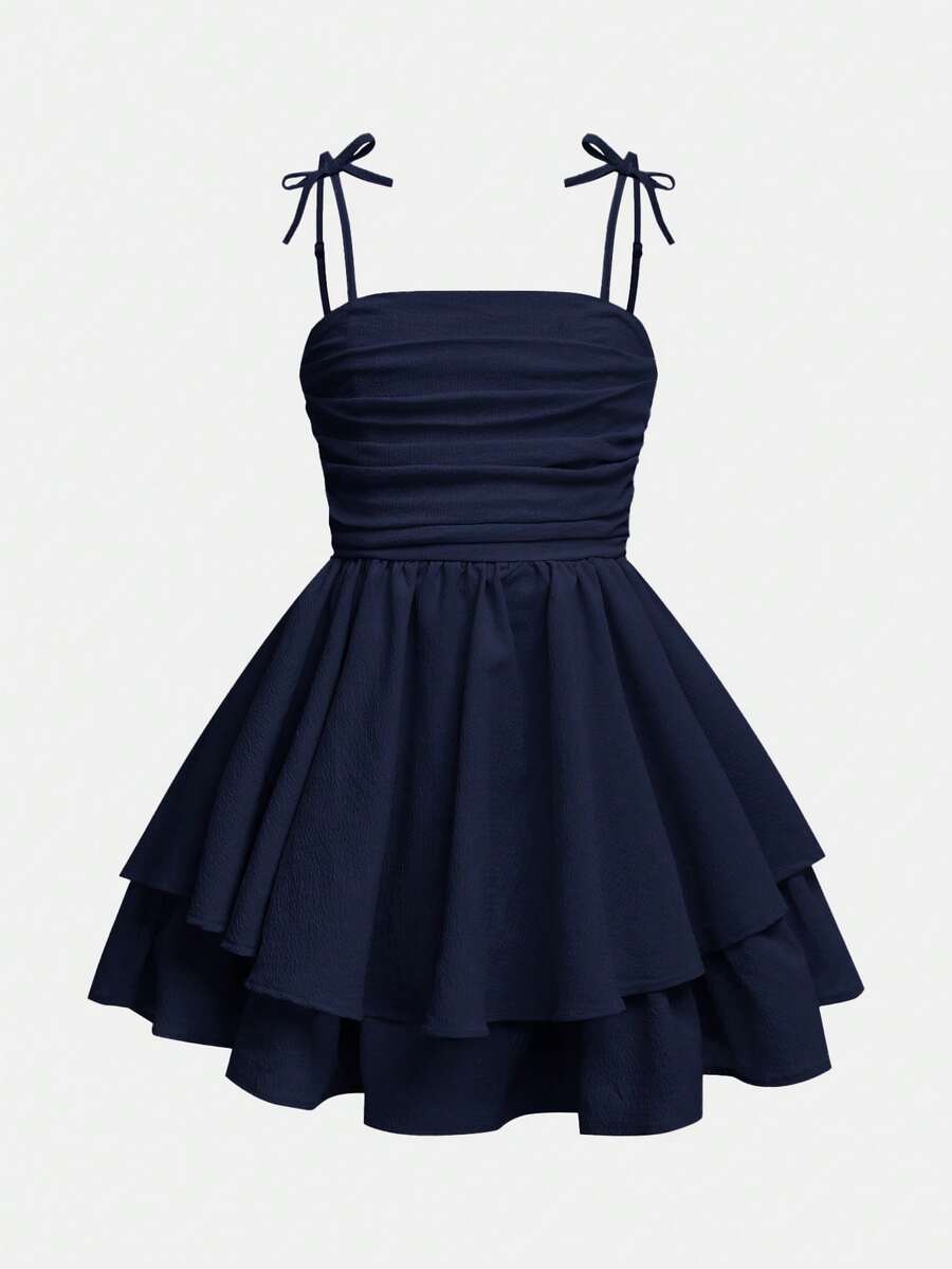 Tween girls apricot tiered cami dress with spaghetti straps, high waist, and slim fit layered hem.