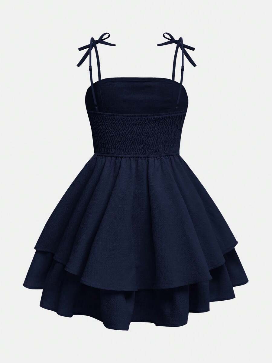Tween girls apricot tiered cami dress with spaghetti straps, high waist, and slim fit layered hem.