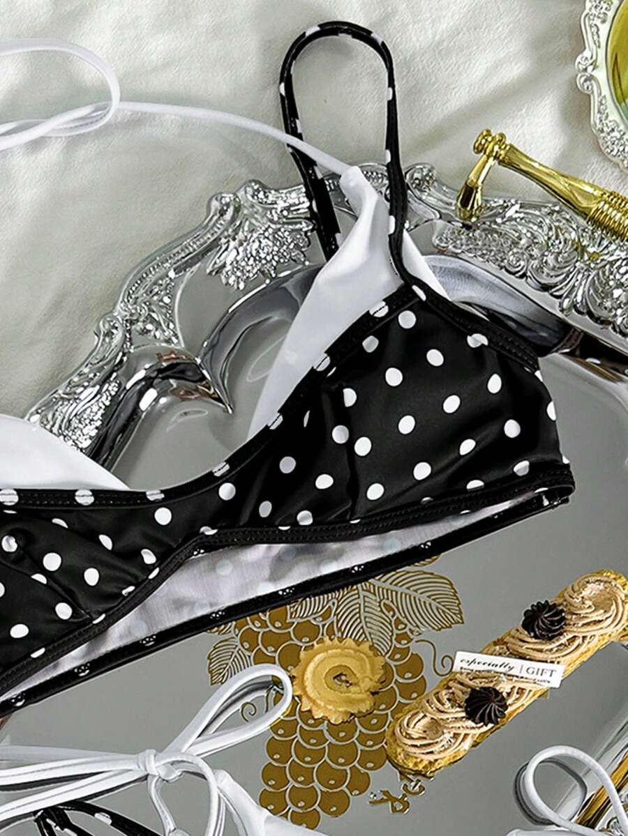 Women's retro polka dot high waist bikini swimsuit set with spaghetti straps and knot tie-back top.