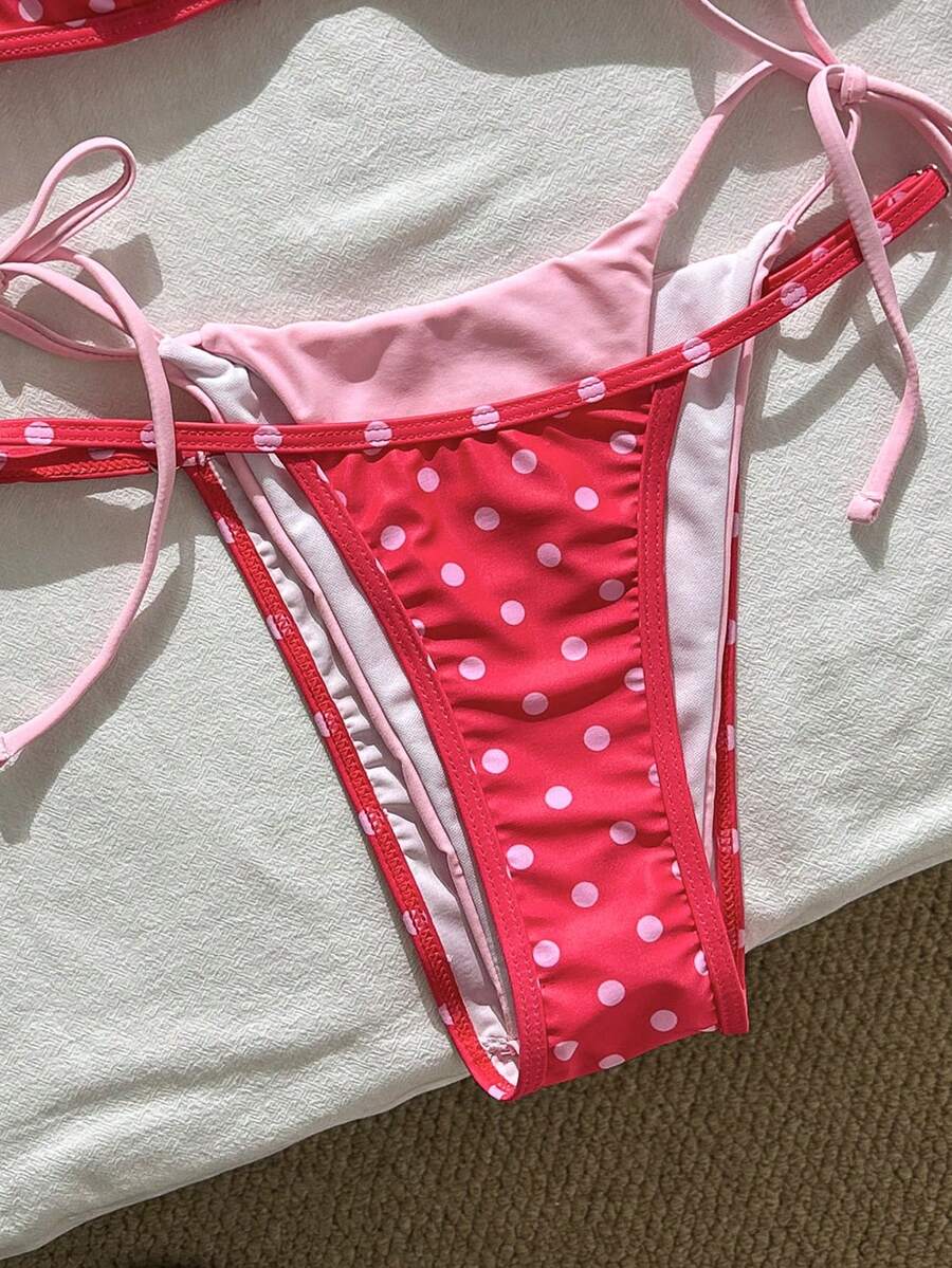Women's retro polka dot high waist bikini swimsuit set with spaghetti straps and knot tie-back top.