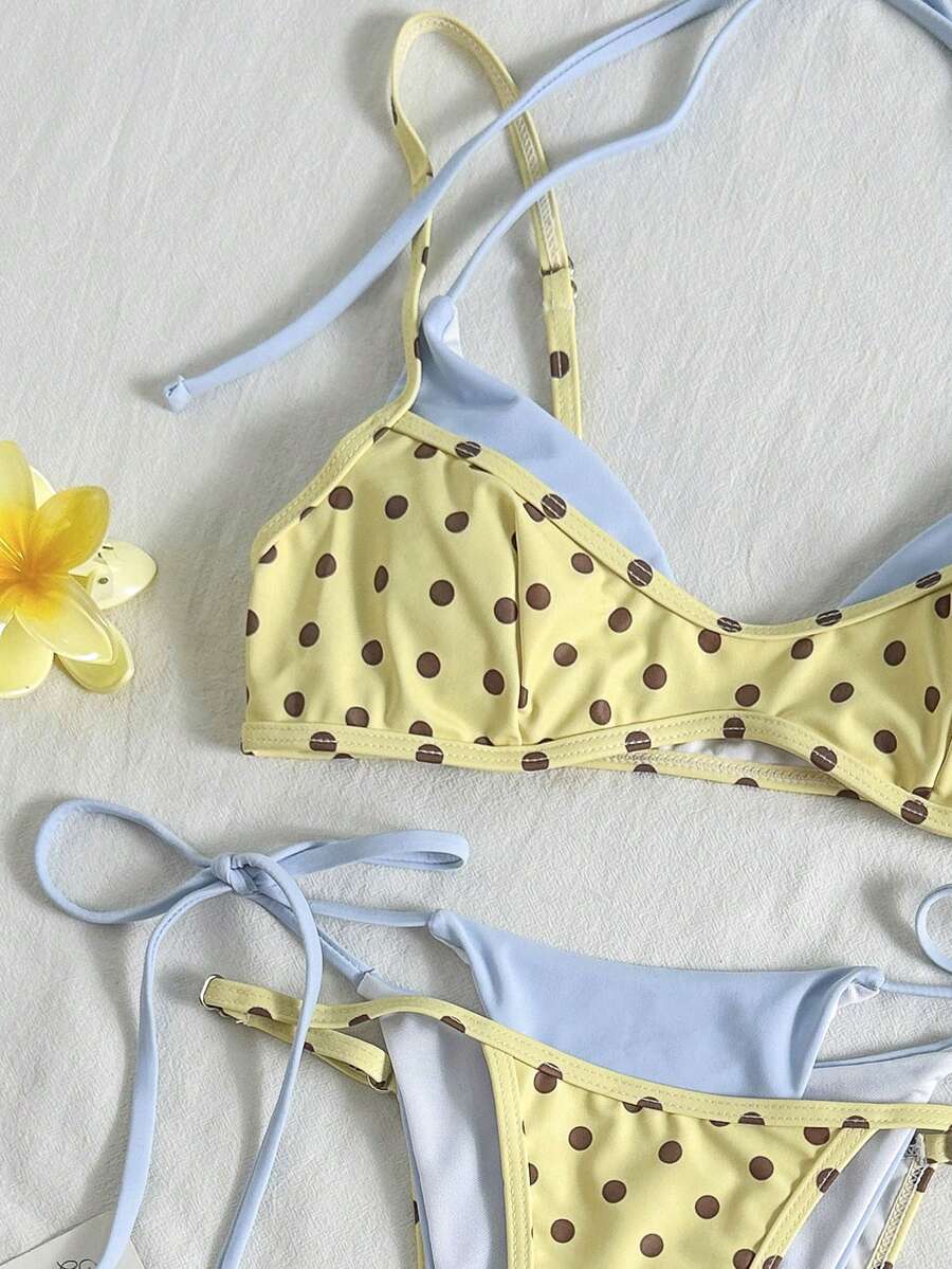 Women's retro polka dot high waist bikini swimsuit set with spaghetti straps and knot tie-back top.