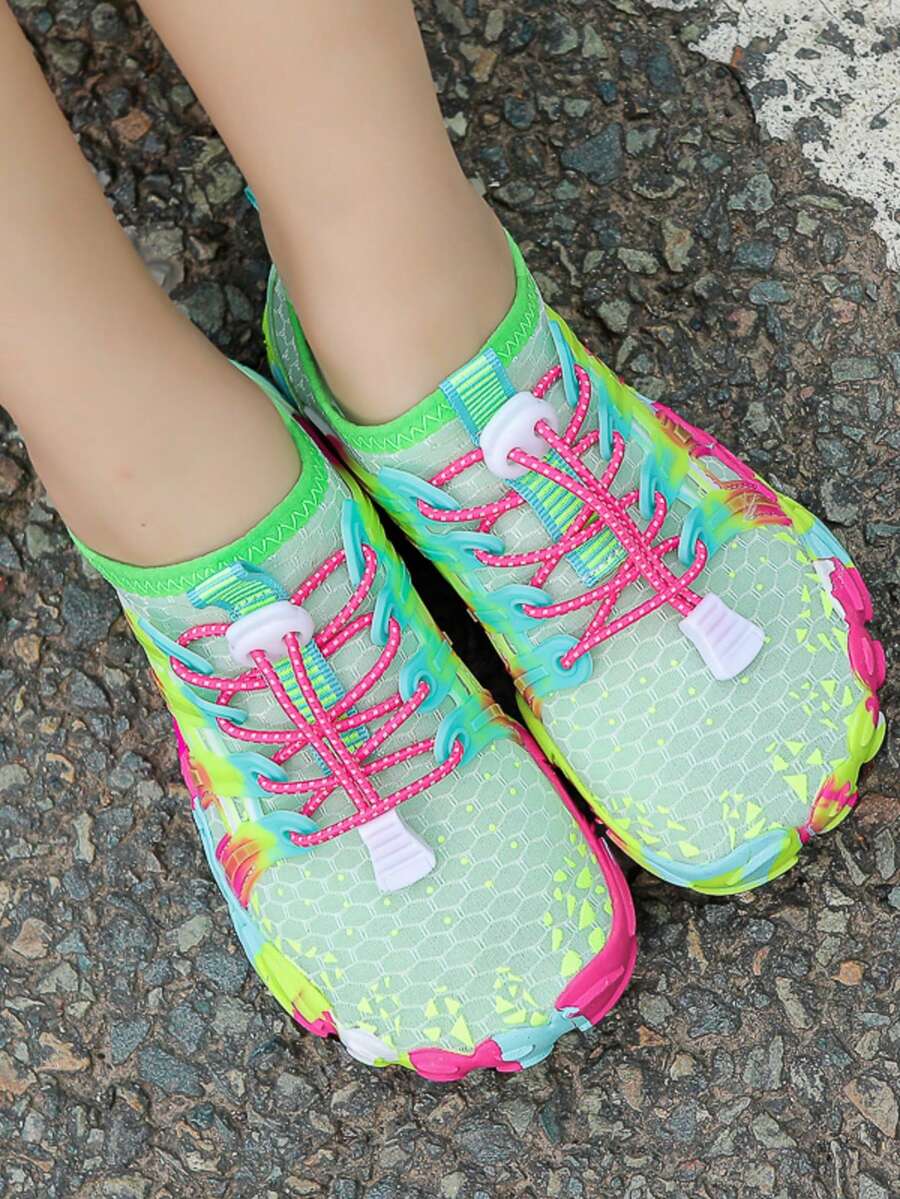 Girls purple quick-drying water shoes featuring a geometric pattern, slip-on fit with lace-up detail, and rubber outsole.