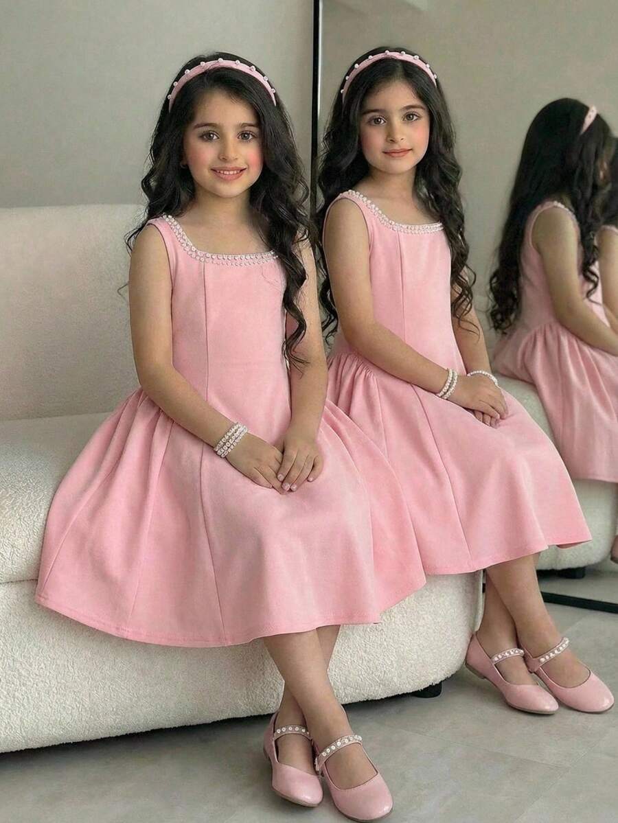 Sleeveless pink square neck A-line dress for tween girls featuring pearl embellishments and a high-waist slim fit design.