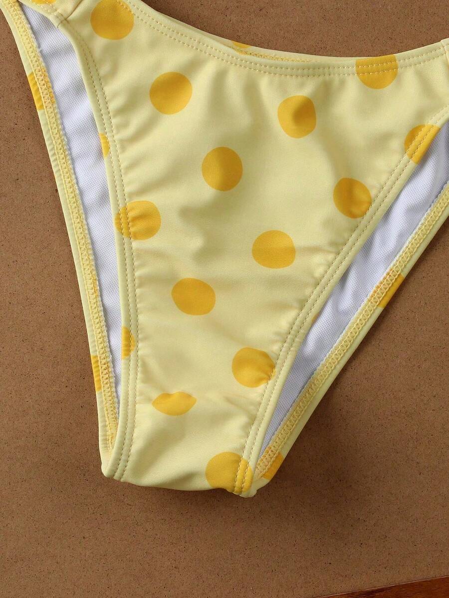 Women's halter neck bikini swimwear set featuring a wireless bra top with removable padding and mid waist bikini bottom.