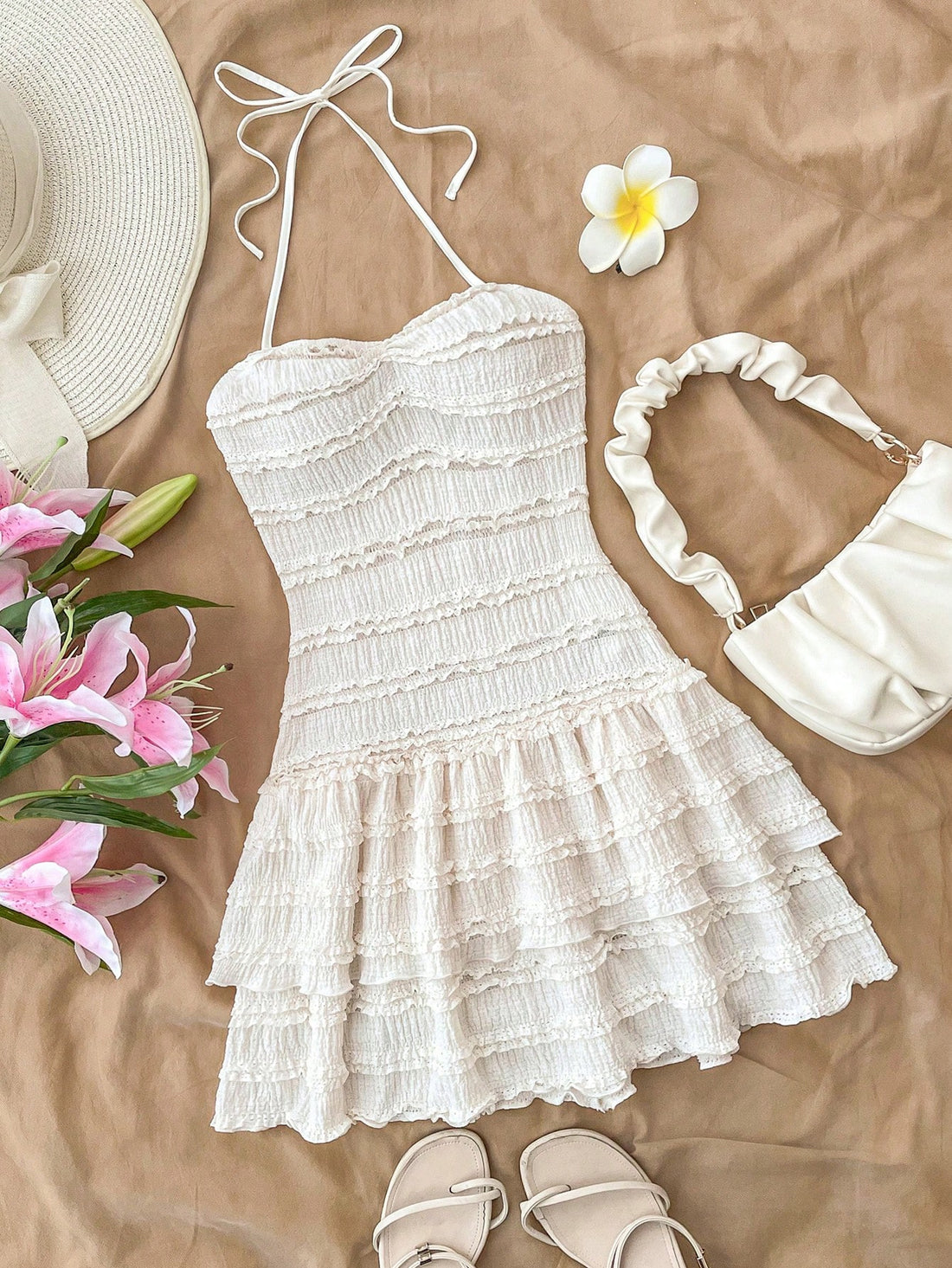 White tween girl sleeveless halter mini dress with asymmetrical tiered ruffle hem, high waist, zipper detail, and A-line slim fit