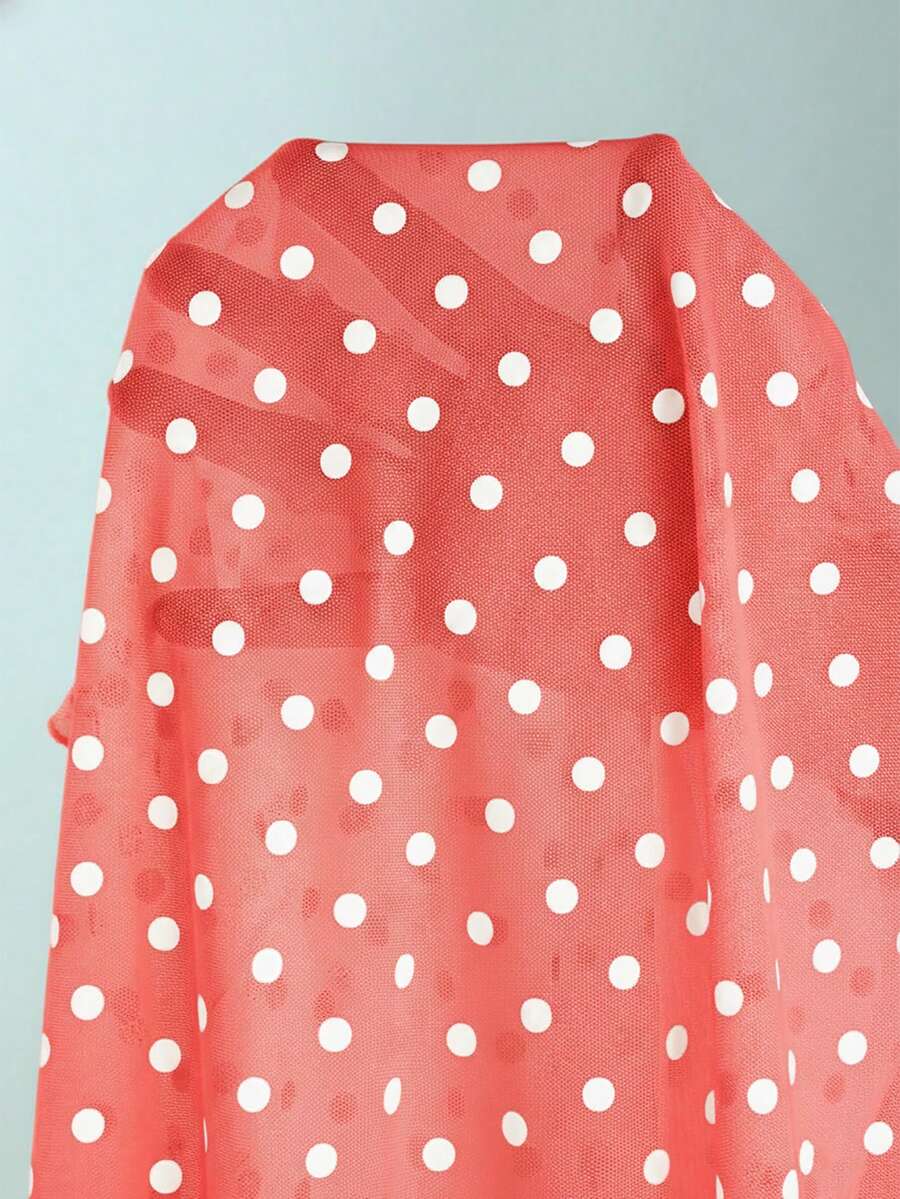 Women's apricot polka dot two-piece swimsuit featuring an asymmetrical halter backless top with knot tie detail and high-waisted bottoms.