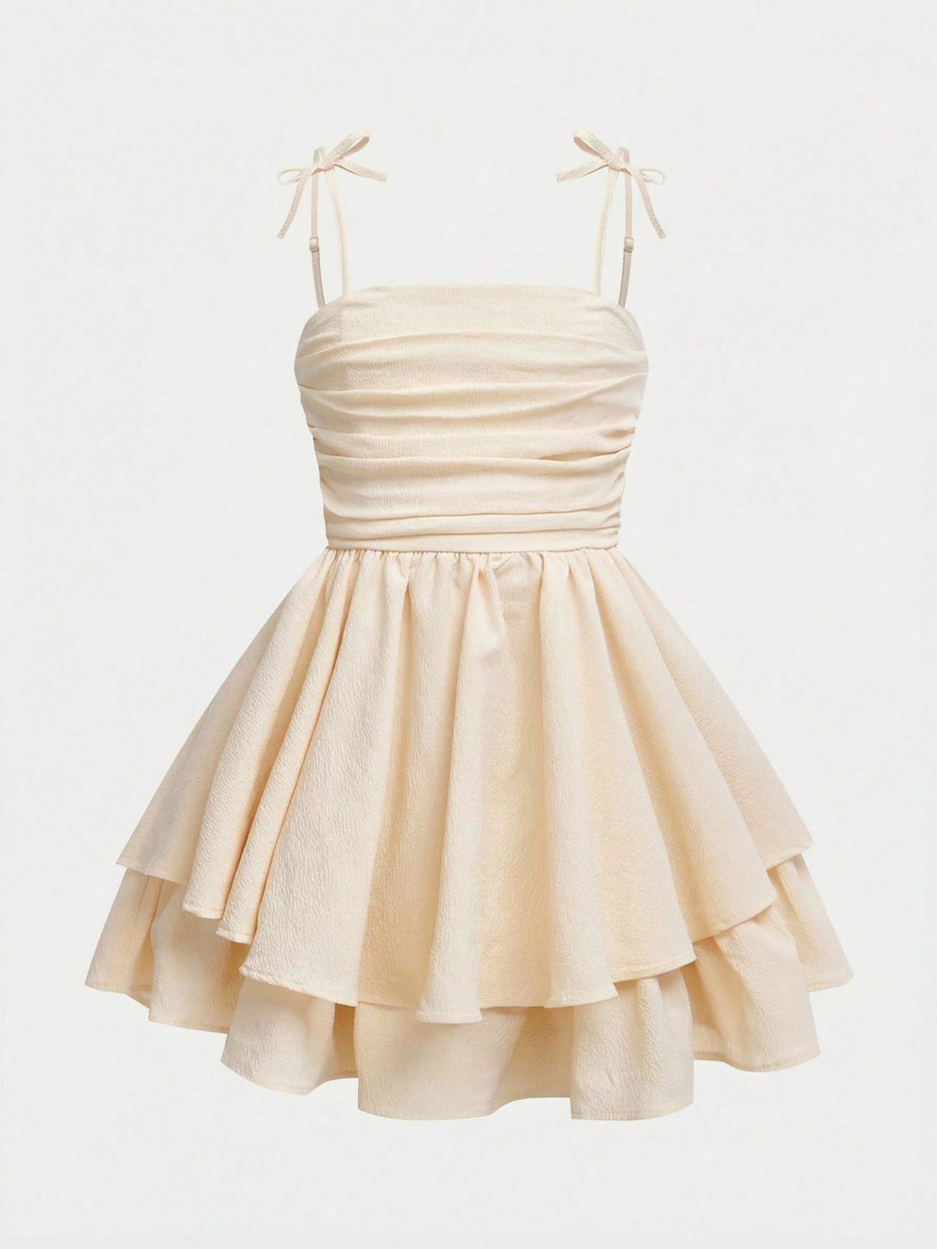 Tween girls apricot tiered cami dress with spaghetti straps, high waist, and slim fit layered hem.