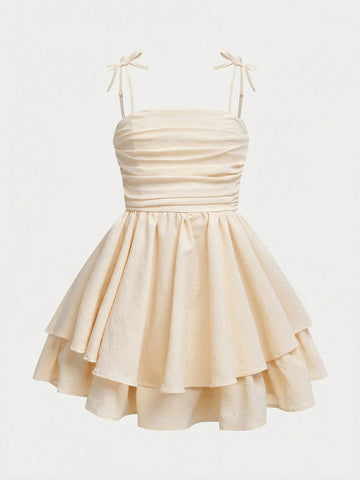 Tween girls apricot tiered cami dress with spaghetti straps, high waist, and slim fit layered hem.