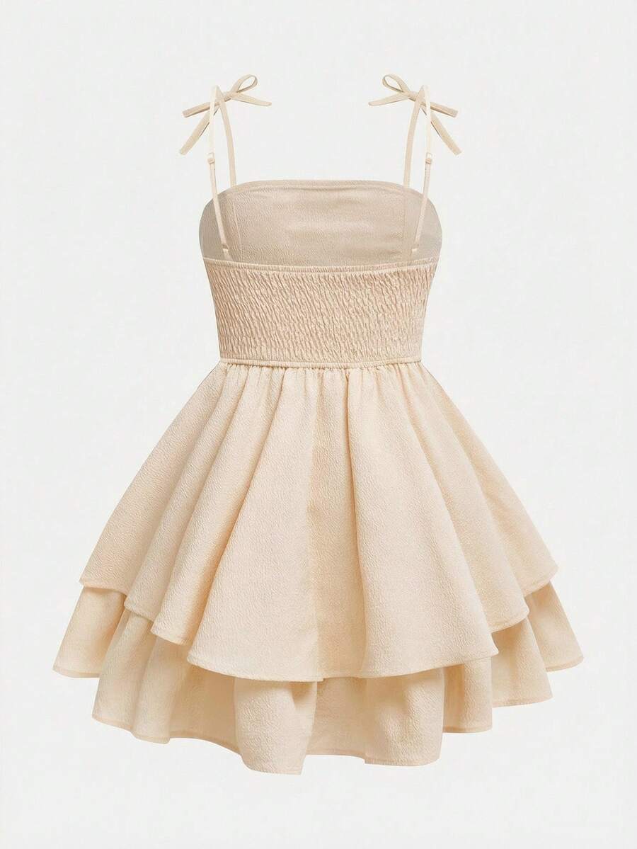 Tween girls apricot tiered cami dress with spaghetti straps, high waist, and slim fit layered hem.