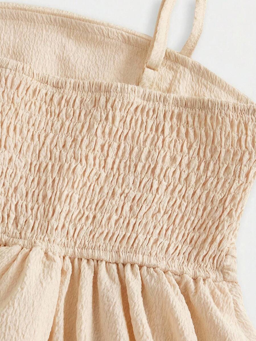 Tween girls apricot tiered cami dress with spaghetti straps, high waist, and slim fit layered hem.