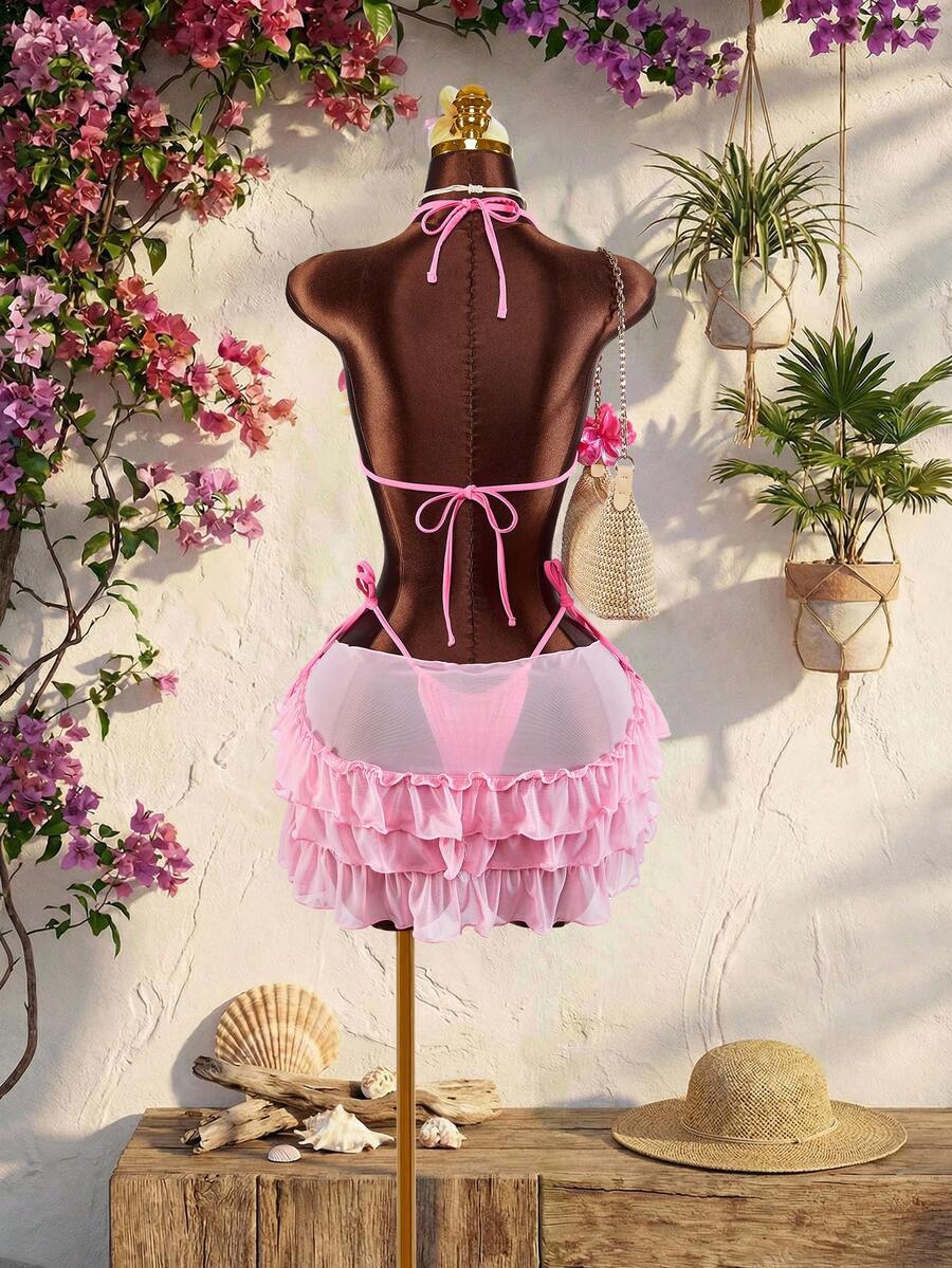 Women's 3-piece blue bikini swimwear set featuring a crop top with 3D rose accents, tie back detail, spaghetti straps, and tie-side bottoms.