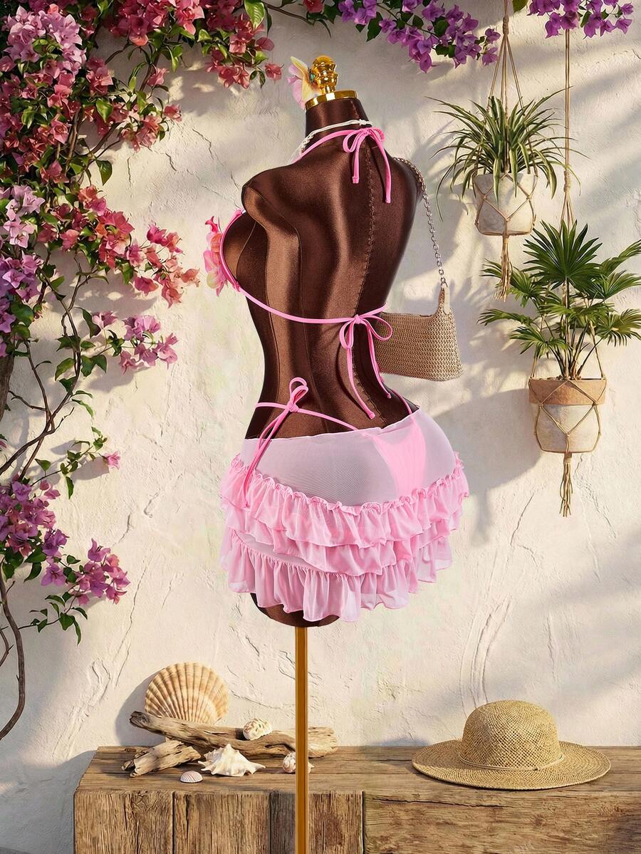 Women's 3-piece blue bikini swimwear set featuring a crop top with 3D rose accents, tie back detail, spaghetti straps, and tie-side bottoms.