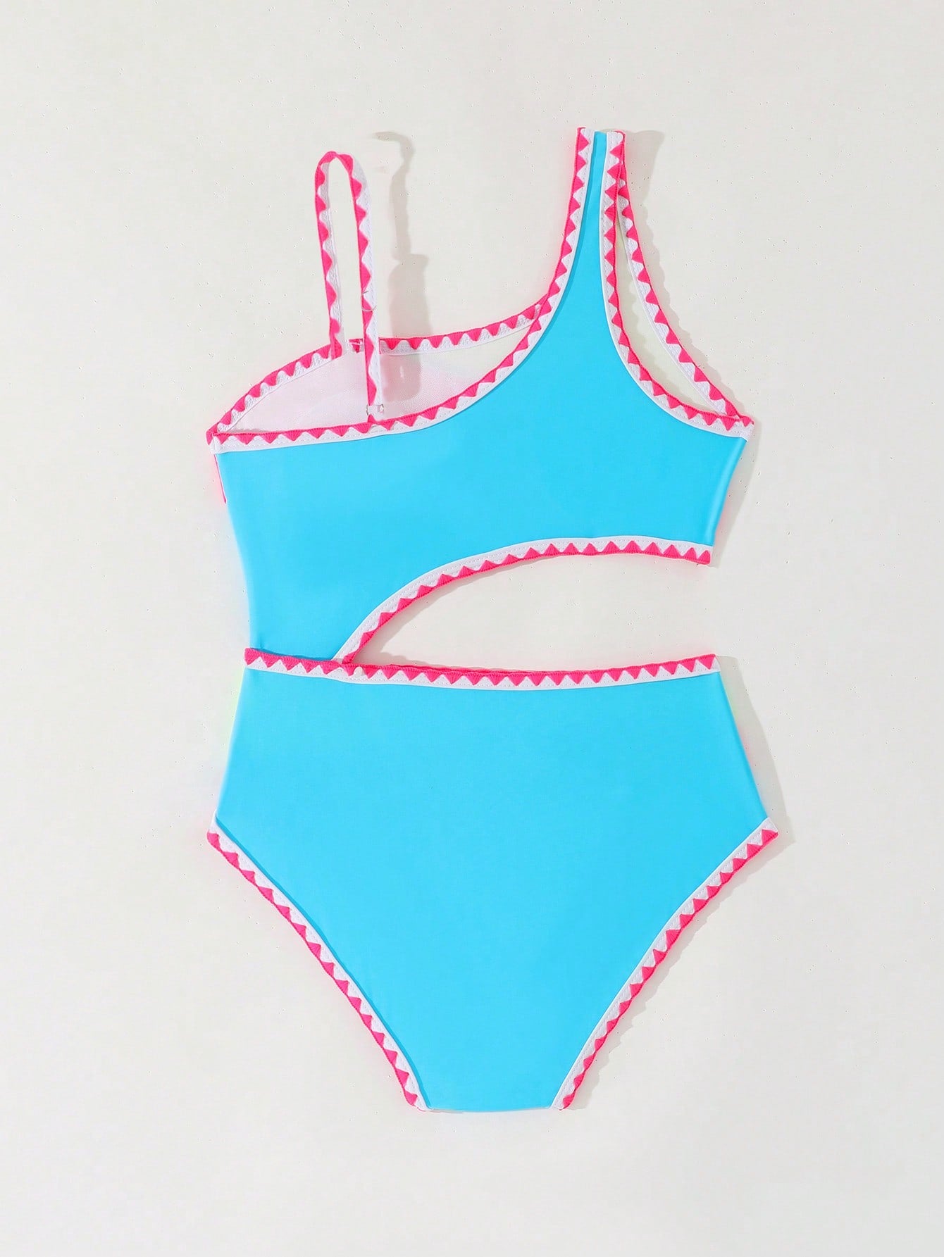 Tween girls one-piece swimsuit featuring an asymmetric neckline, pendant decor, plain design, wireless bra, high-cut bottom, and medium-stretch fabric.