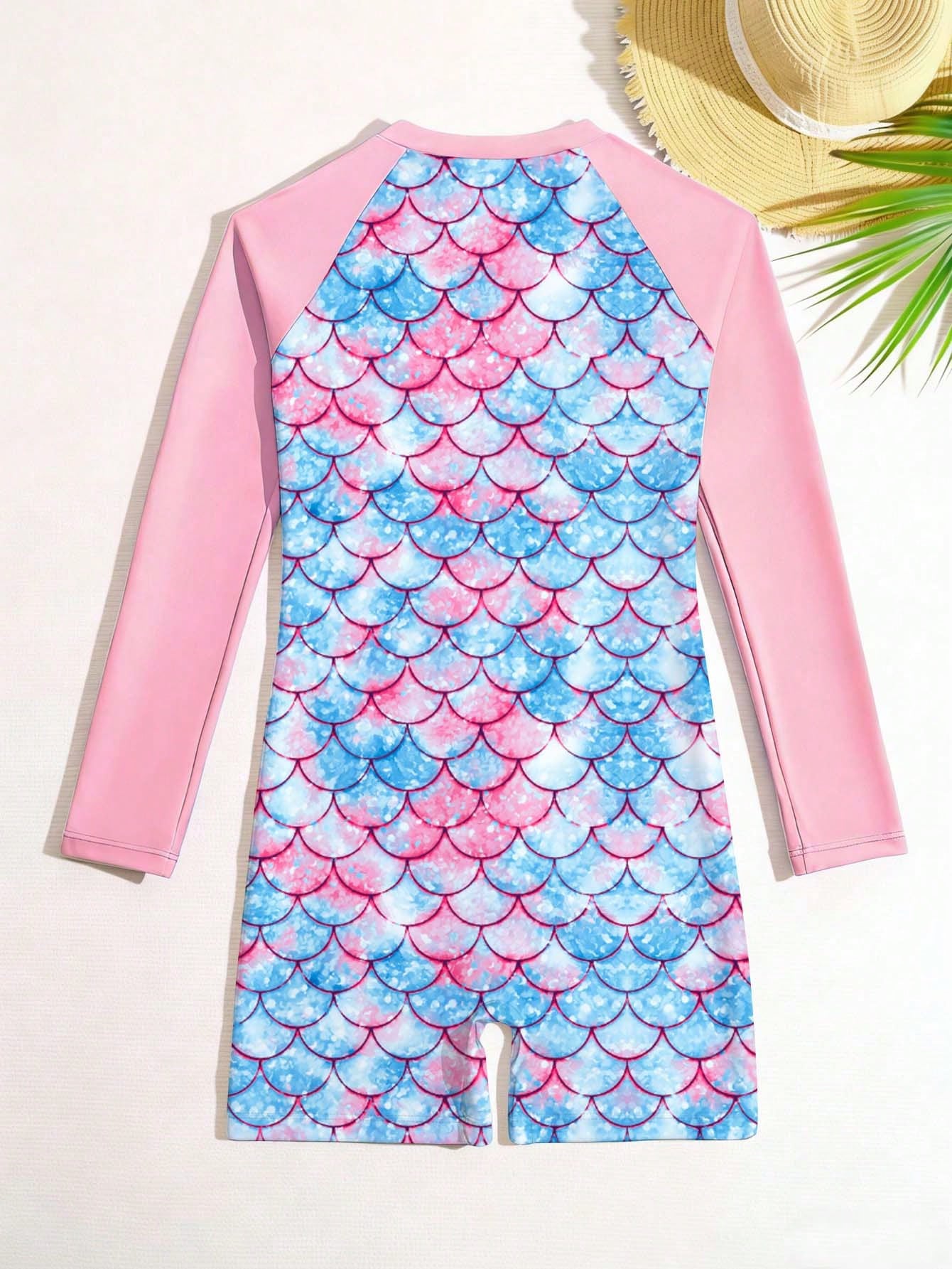 Tween girls one-piece swimsuit featuring a high neck, long sleeves, and shorts bottom, with a back zipper and strawberry plaid digital print on stretch knit fabric. Designed for swimming, vacation, and summer wear.