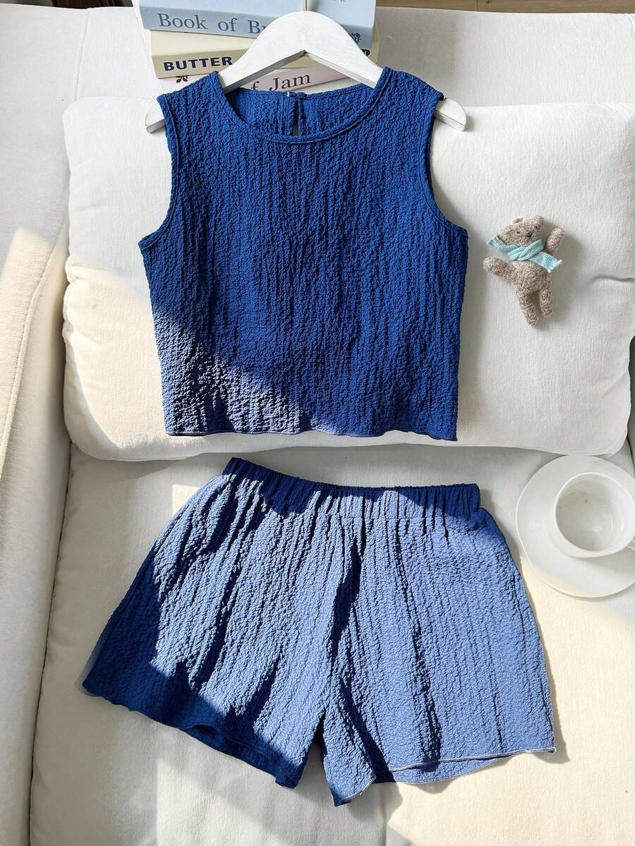 Tween girls casual blue tank top featuring round neck, textured fabric, and bow detail paired with matching shorts set.