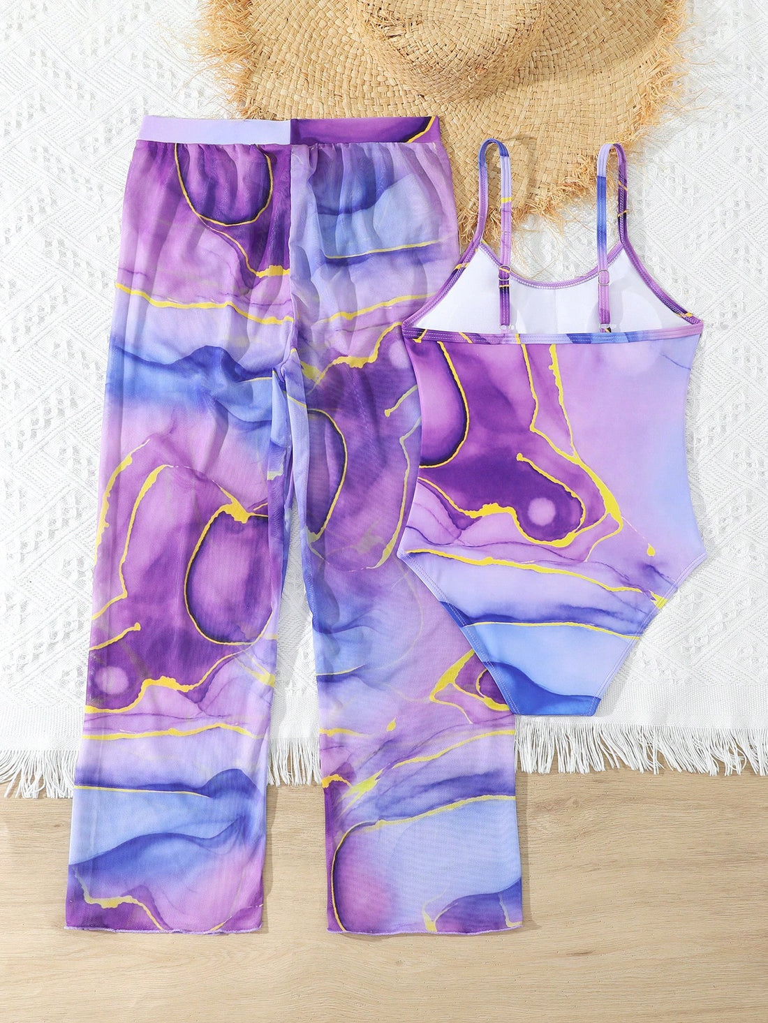 Purple tween girls one-piece swimsuit set with spaghetti straps, graphic all-over print, pocket detail, and matching long pants for beach or pool vacation wear.