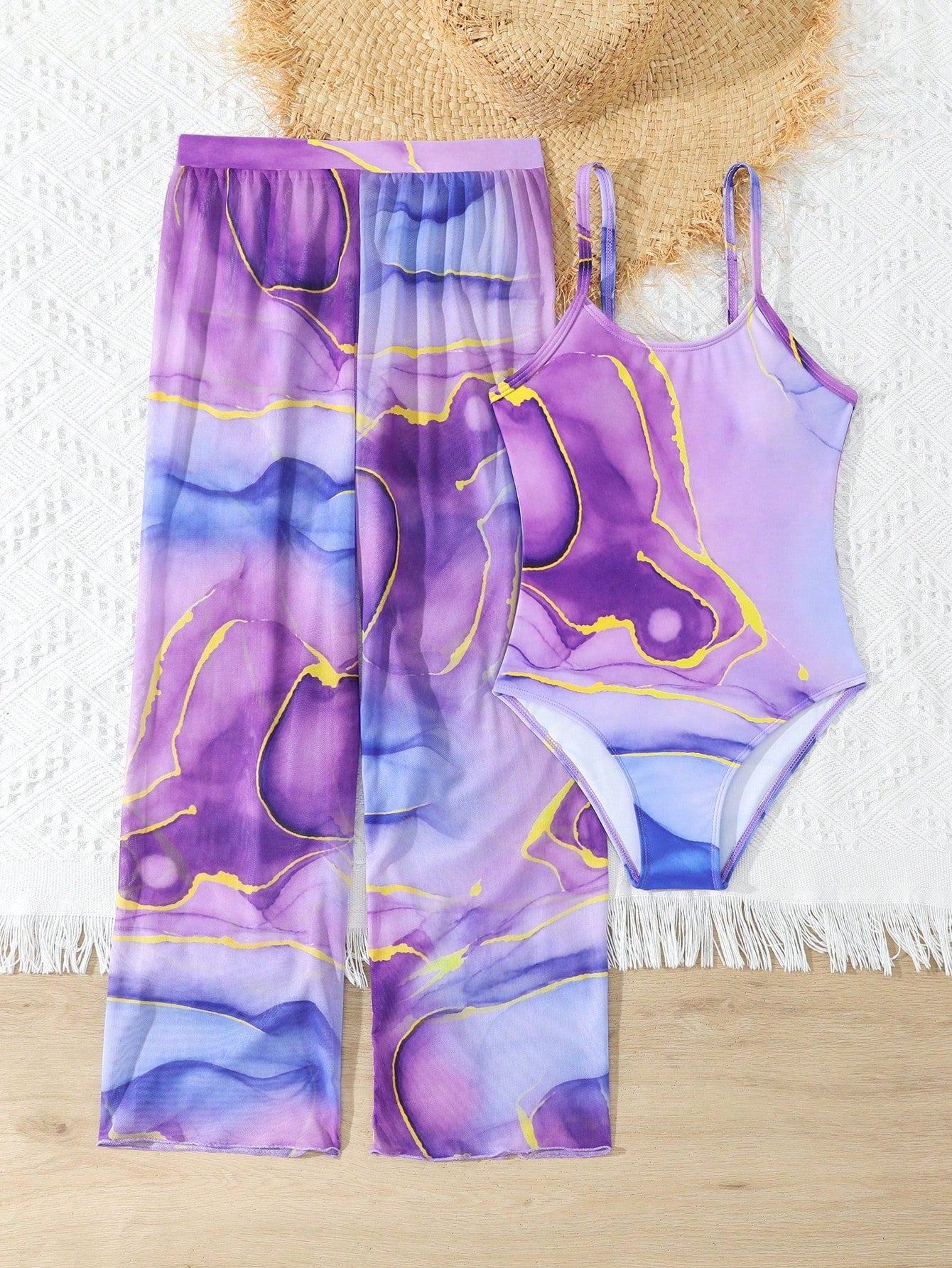 Purple tween girls one-piece swimsuit set with spaghetti straps, graphic all-over print, pocket detail, and matching long pants for beach or pool vacation wear.