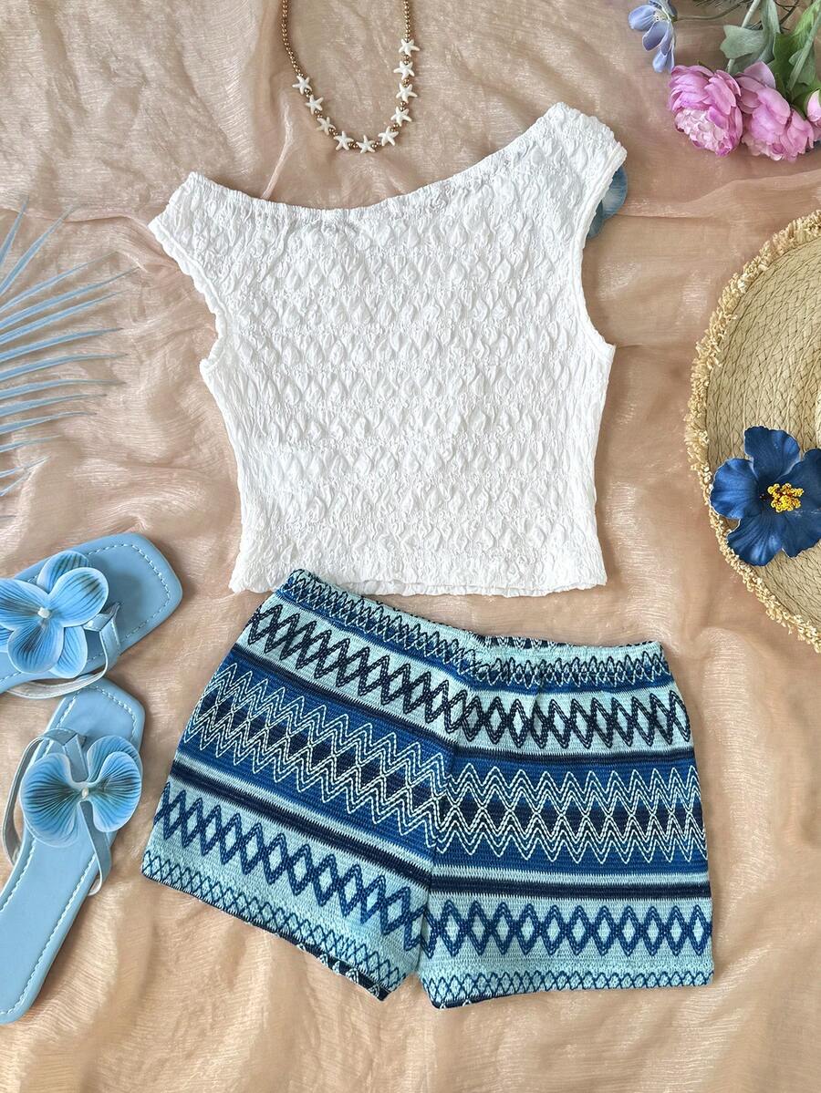 Tween girls 2-piece summer clothing set featuring a black asymmetric rib-knit striped off-shoulder t-shirt and matching slim fit shorts.