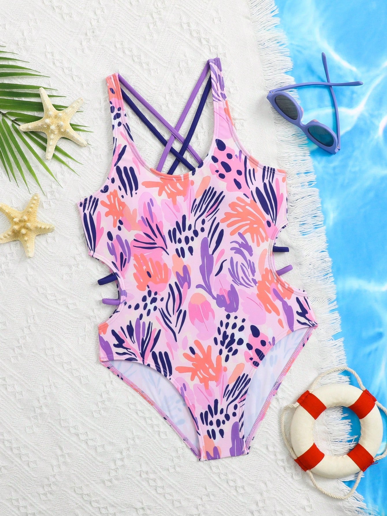 Tween girl multicolor one-piece swimsuit with gradient heart graphic print, scoop neck, cutout detail, and fitted vacation beachwear style.