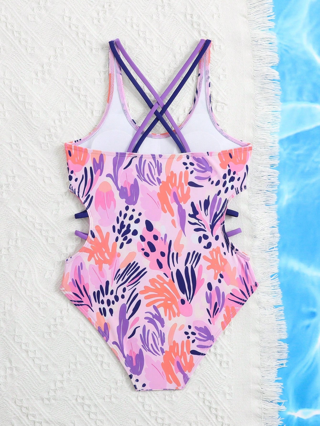Tween girl multicolor one-piece swimsuit with gradient heart graphic print, scoop neck, cutout detail, and fitted vacation beachwear style.