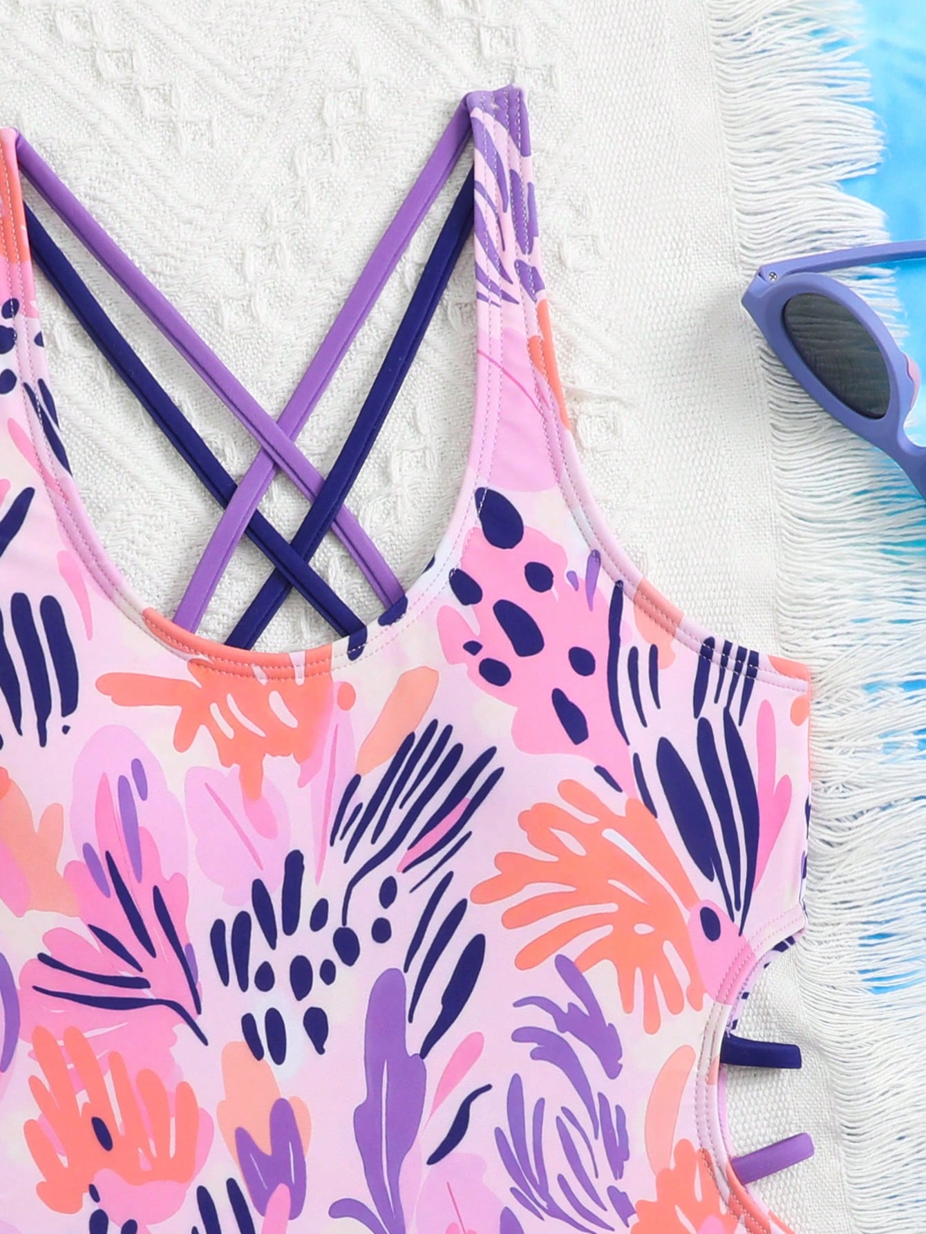 Tween girl multicolor one-piece swimsuit with gradient heart graphic print, scoop neck, cutout detail, and fitted vacation beachwear style.