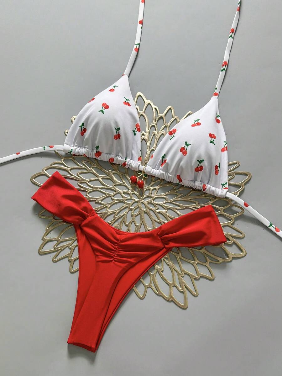 Women's 2-piece triangle cup bikini set in solid color featuring woven pearl shell decoration, halter neckline, and high-waist side-tie ruched bottoms.