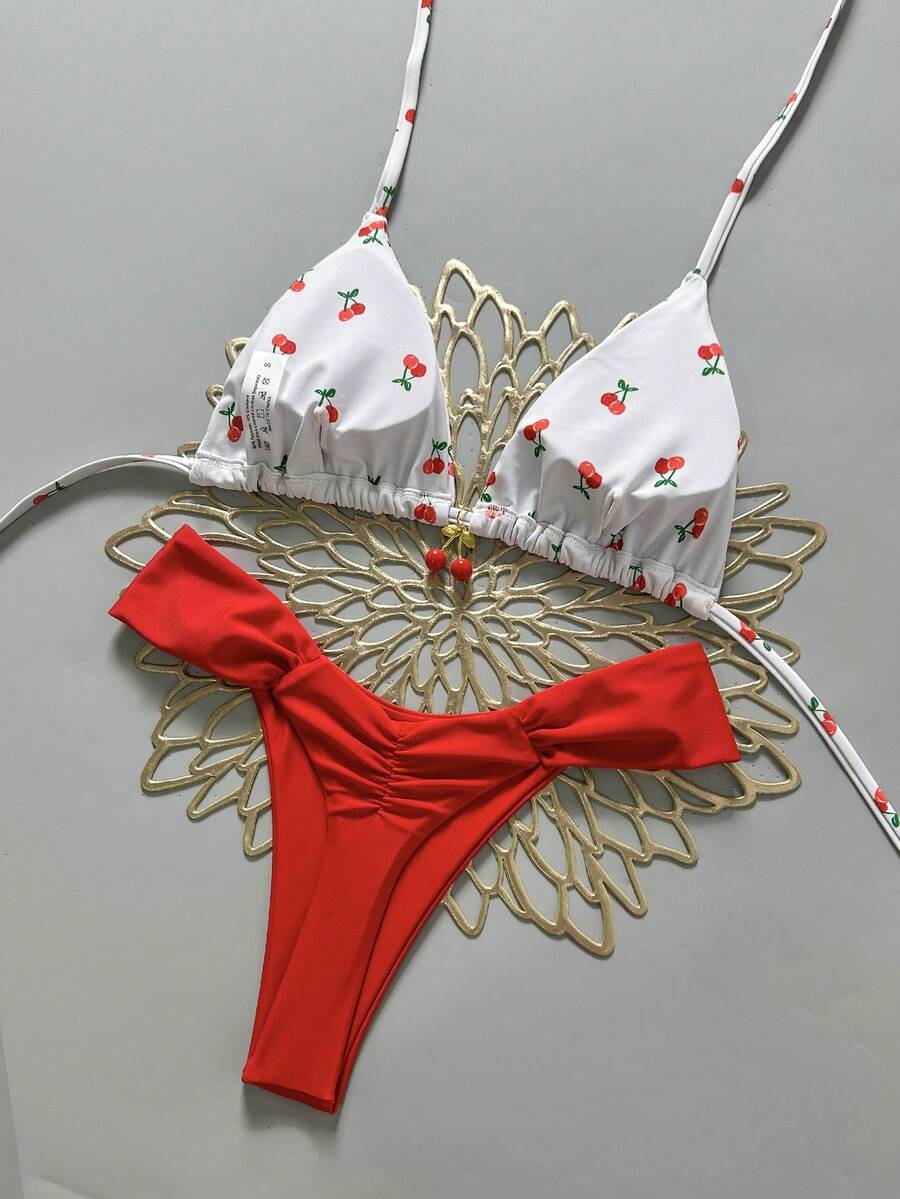 Women's 2-piece triangle cup bikini set in solid color featuring woven pearl shell decoration, halter neckline, and high-waist side-tie ruched bottoms.