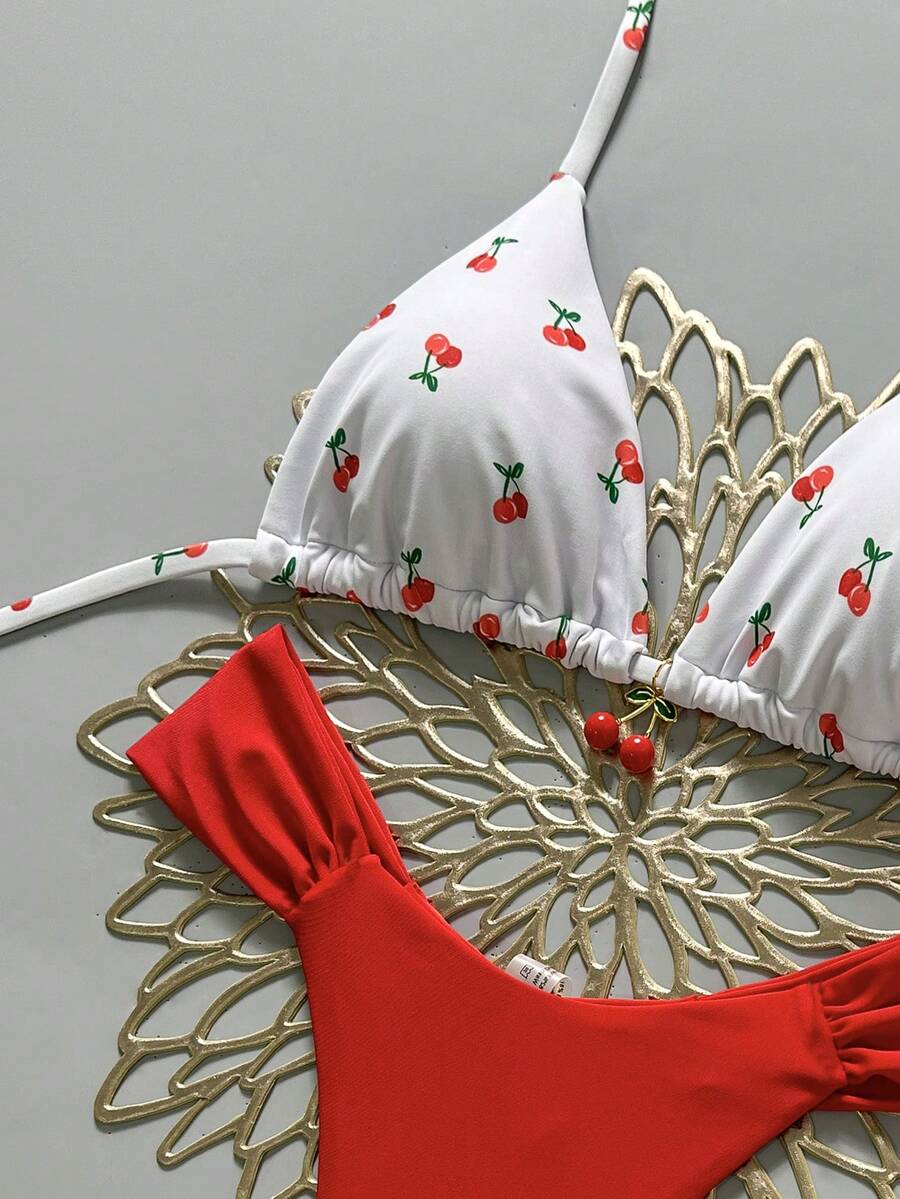Women's 2-piece triangle cup bikini set in solid color featuring woven pearl shell decoration, halter neckline, and high-waist side-tie ruched bottoms.