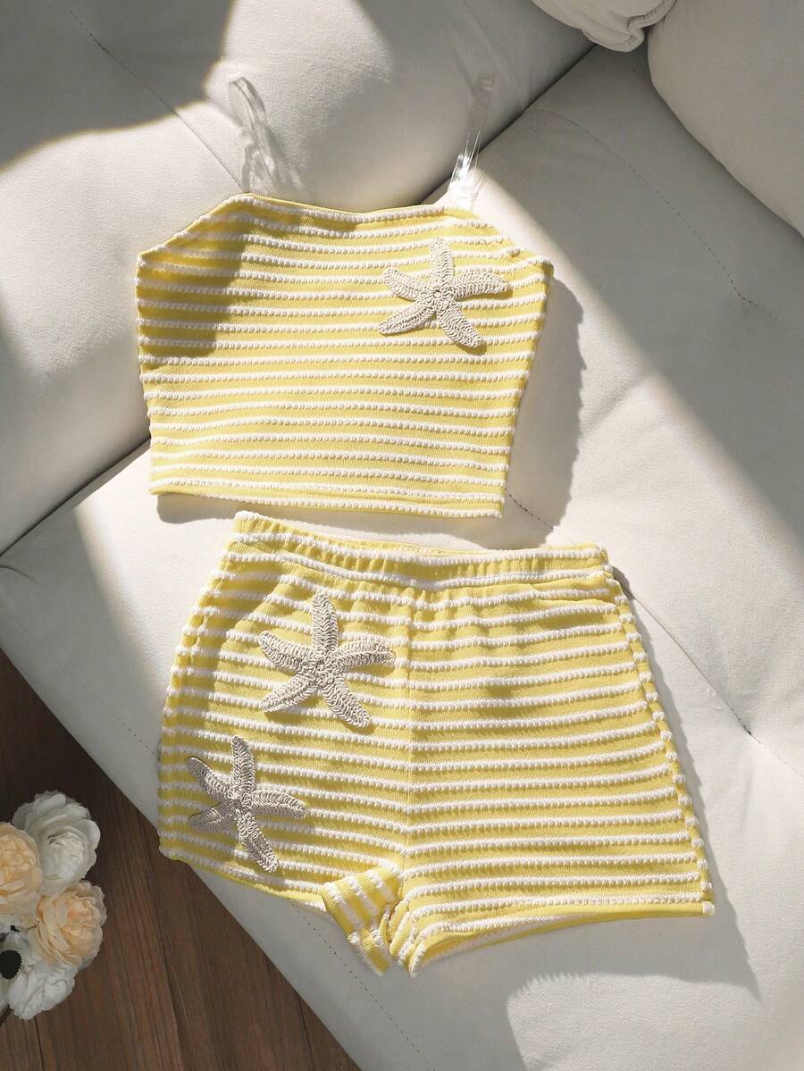 Tween girls black and white striped two-piece set featuring a spaghetti strap micro crop tank top with lettuce trim and ruffle hem paired with matching slim fit shorts.