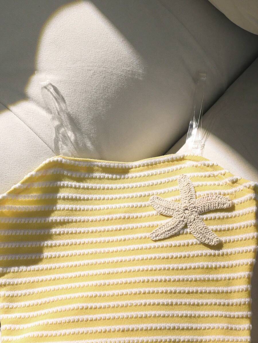 Tween girls black and white striped two-piece set featuring a spaghetti strap micro crop tank top with lettuce trim and ruffle hem paired with matching slim fit shorts.