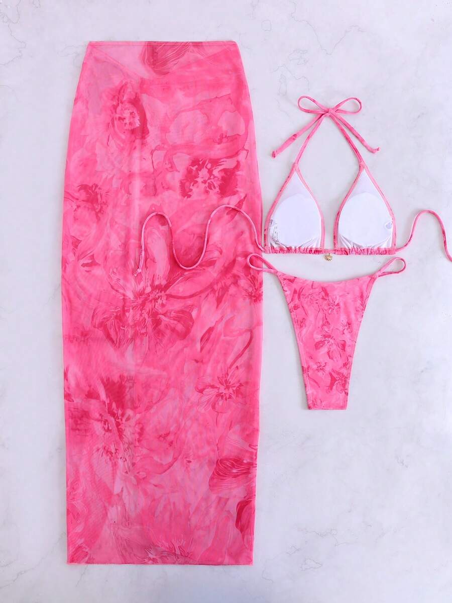Women's 3-piece floral swimsuit set featuring a multicolor tie-back halter bikini top, low-waist bottoms, and a matching sheer mesh maxi skirt.