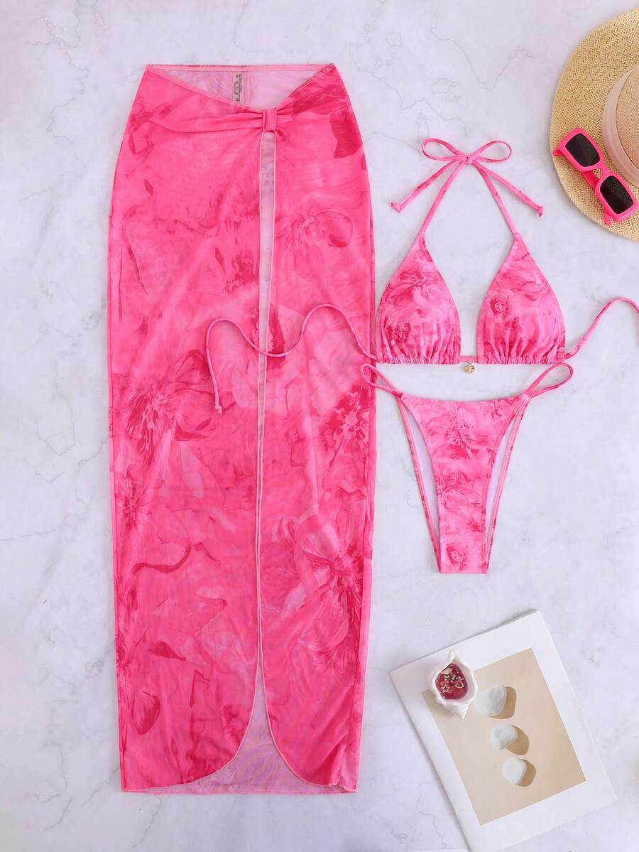Women's 3-piece floral swimsuit set featuring a multicolor tie-back halter bikini top, low-waist bottoms, and a matching sheer mesh maxi skirt.