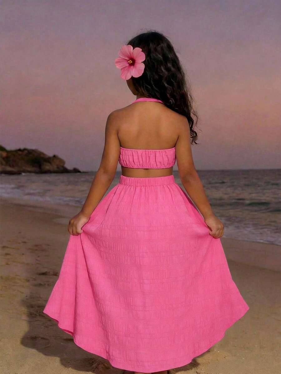 Tween girls floral halter dress with backless sleeveless design, belted high waist, shirred details, appliques, and flared A-line midi silhouette for summer vacation or graduation outfit.